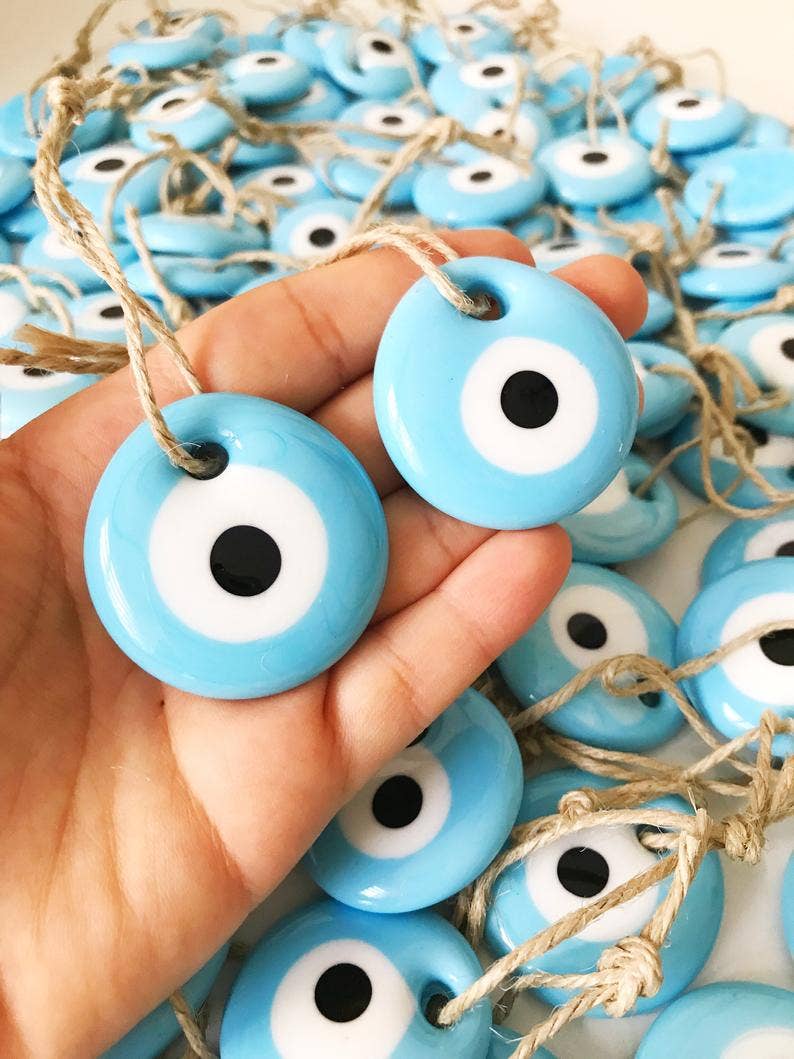 Turquoise evil eye bead with card
